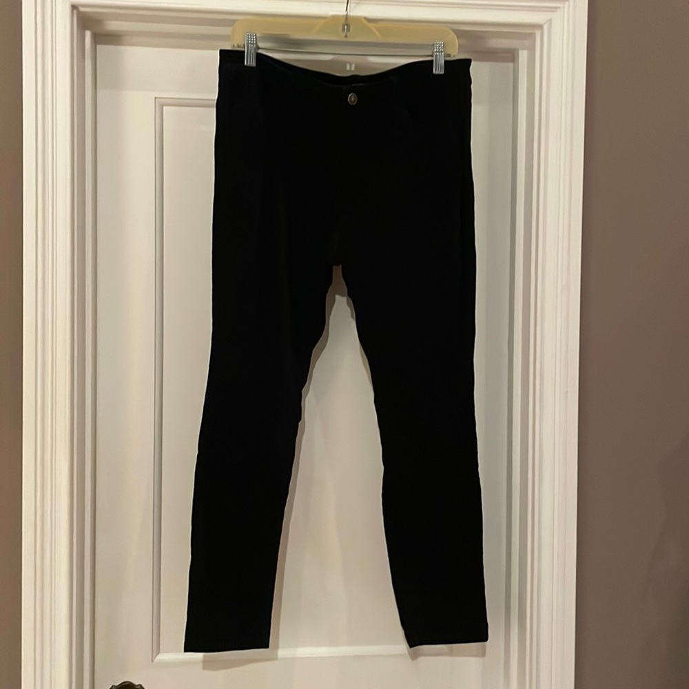 Black, velvety cotton skinny pants.